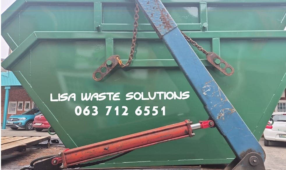 Skip bin being loaded onto our trailer